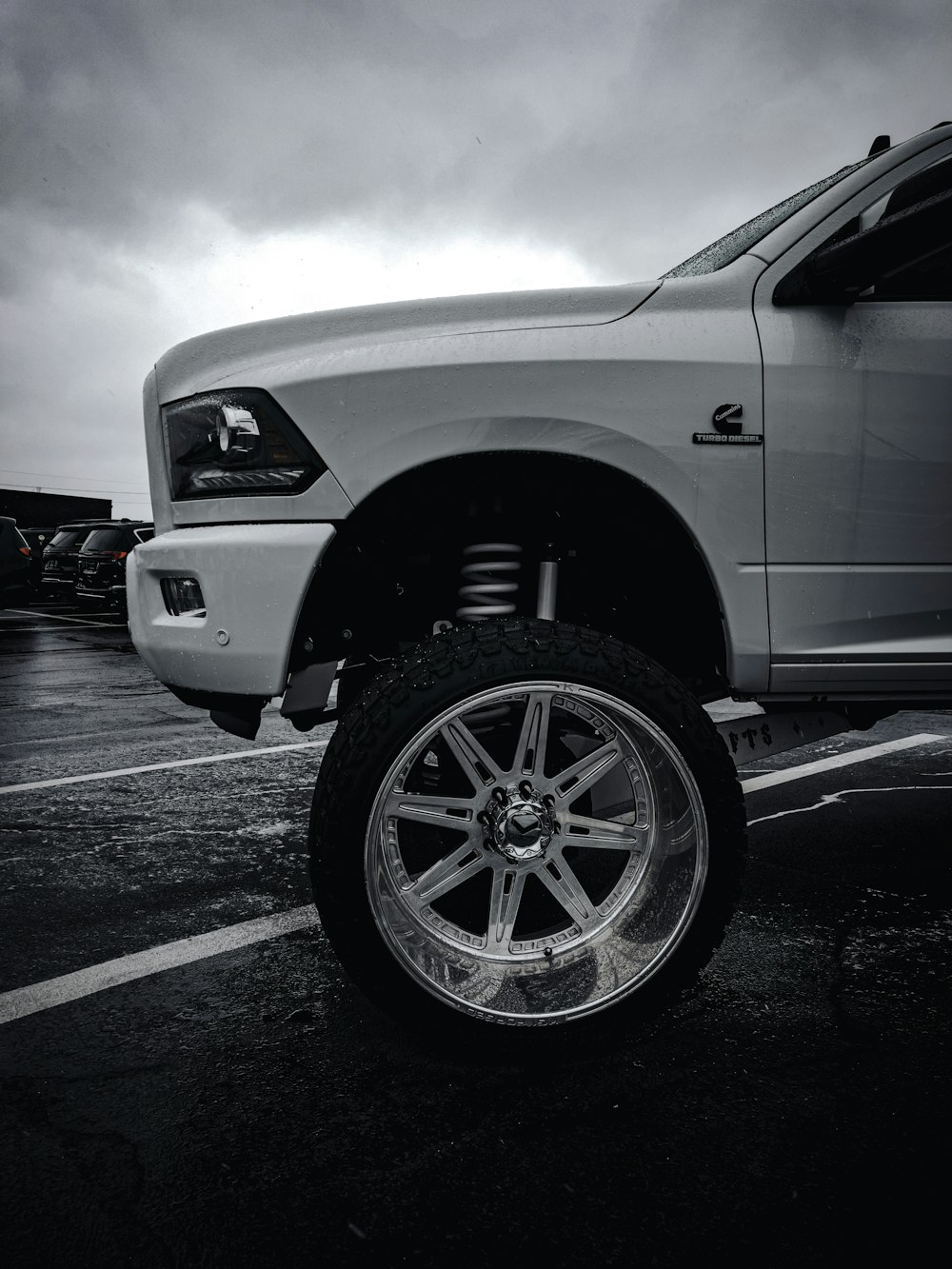 a white truck parked in a parking lot