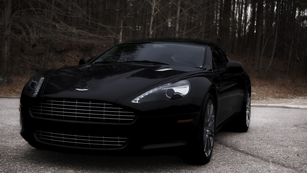 a black sports car parked in a parking lot