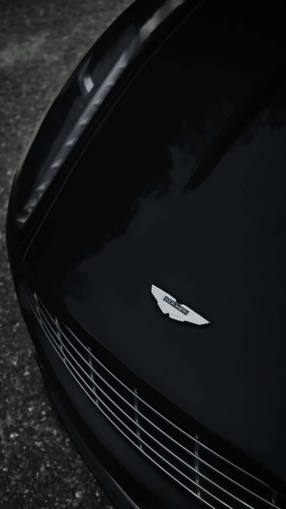 a close up of the front of a black sports car