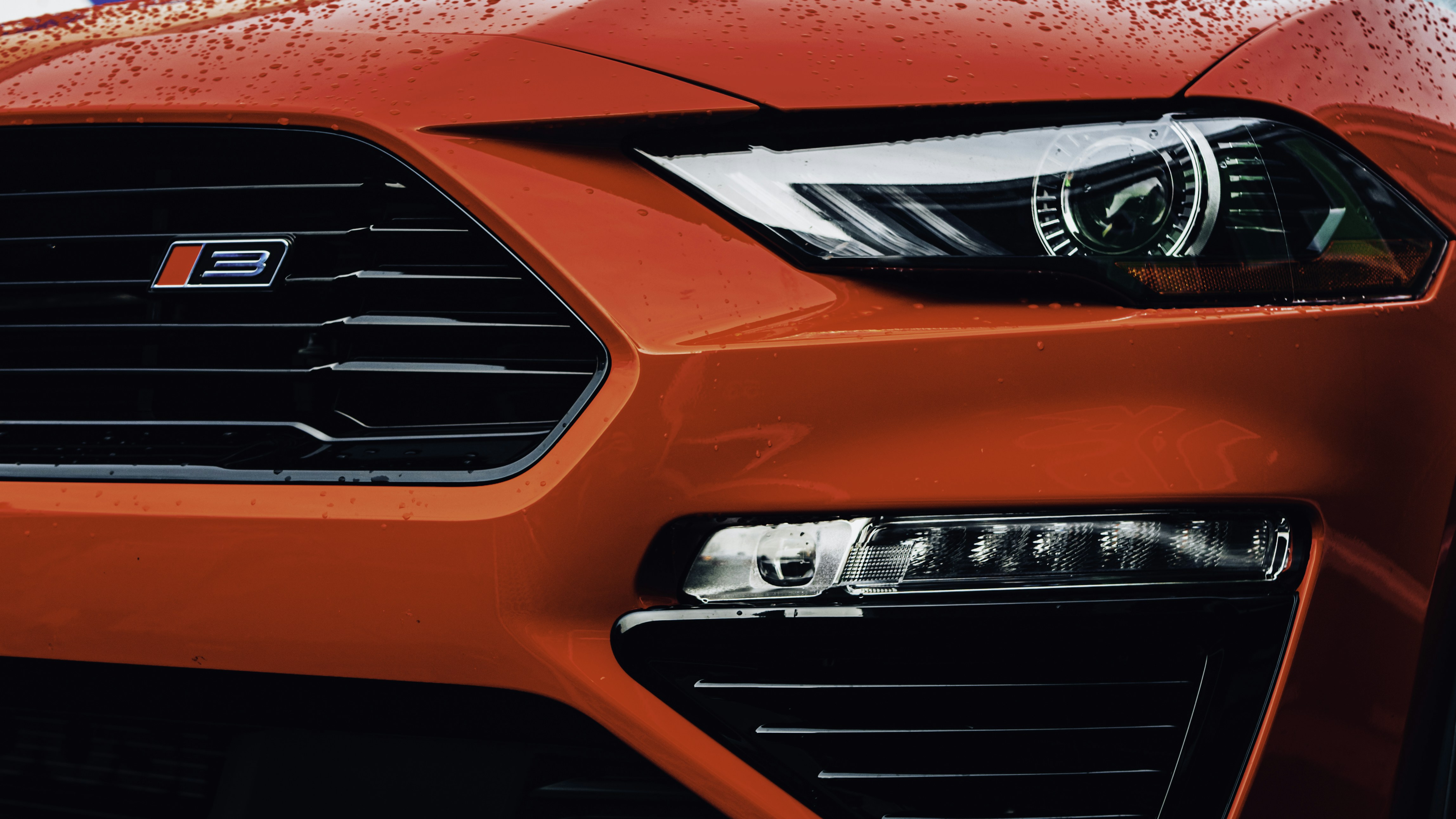 a close up of the front of a red car
