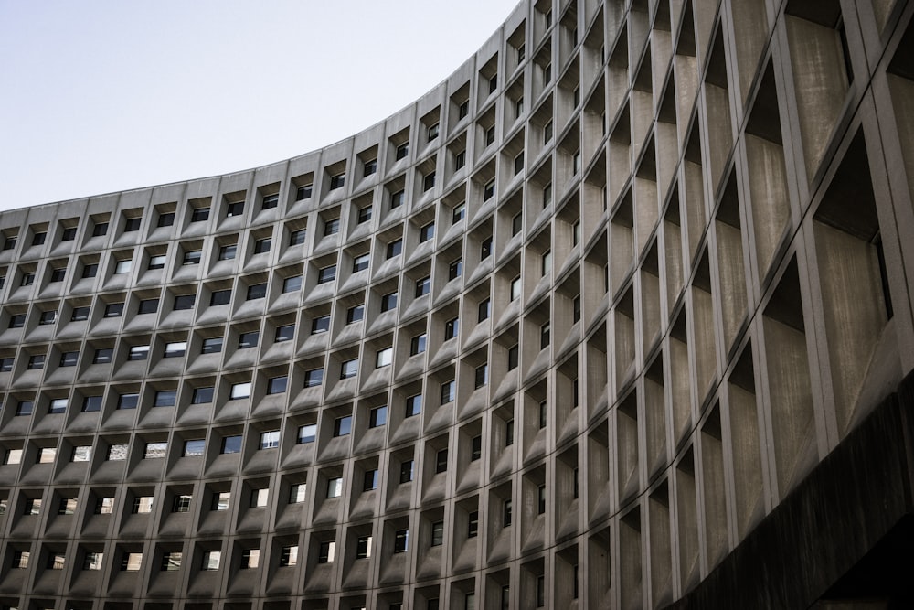 a curved building with lots of windows in it