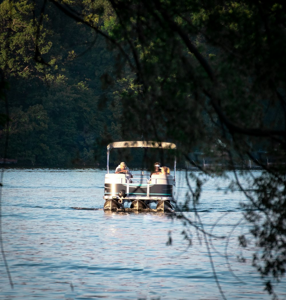 a couple of people on a boat in the water