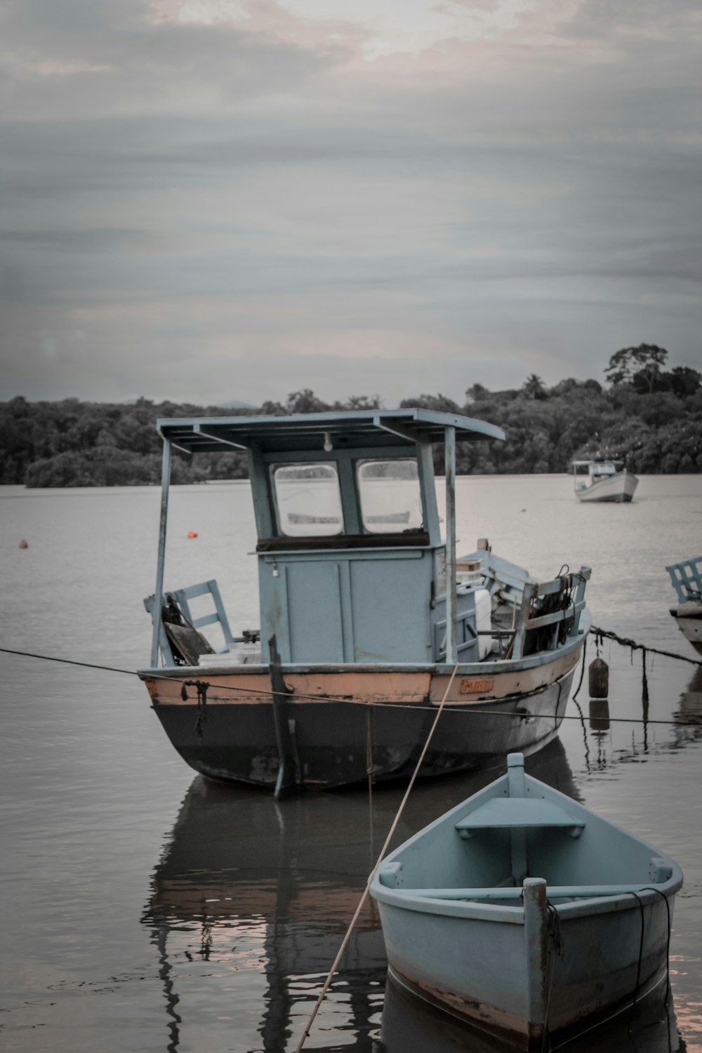 a couple of boats that are sitting in the water