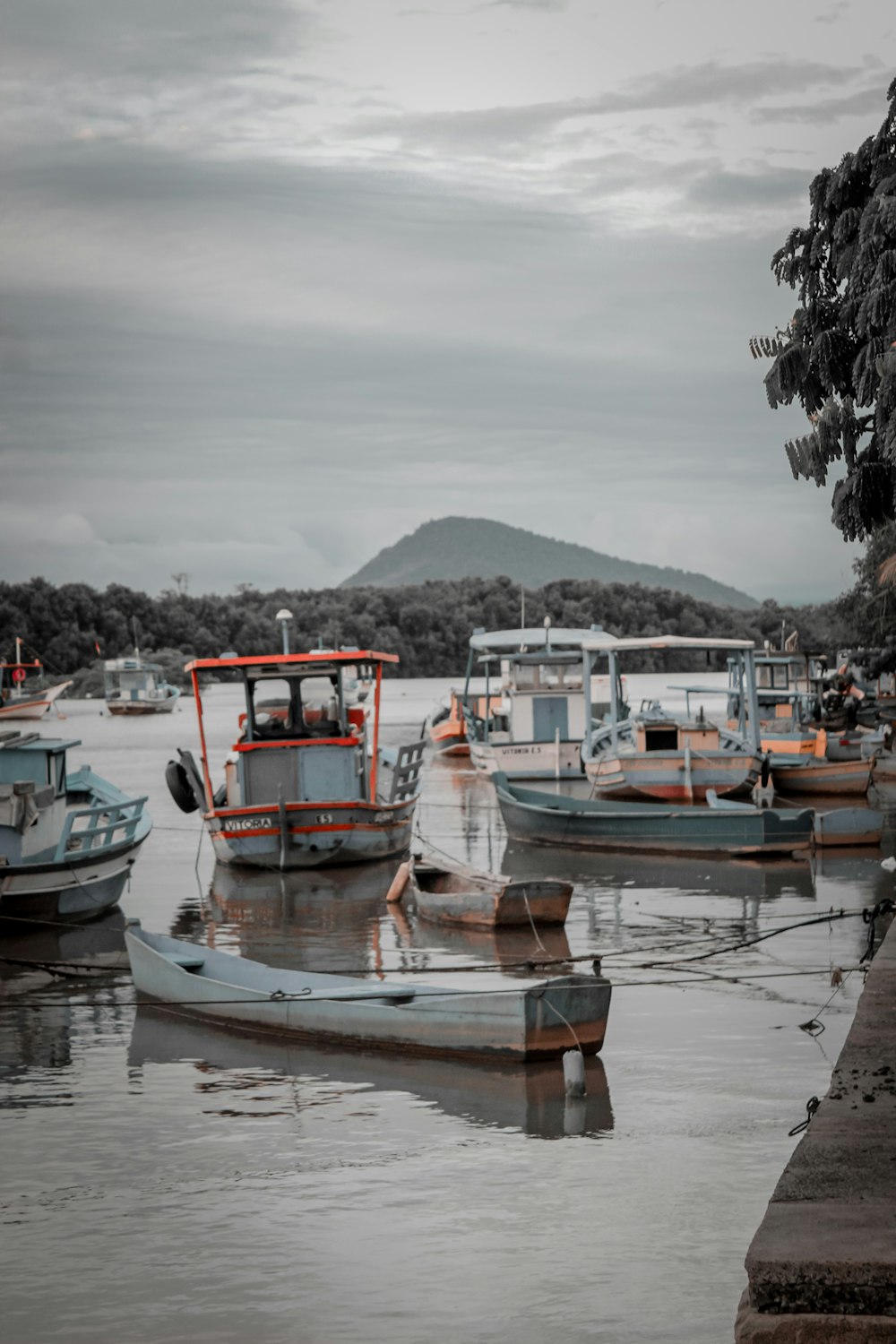 a group of boats floating on top of a lake