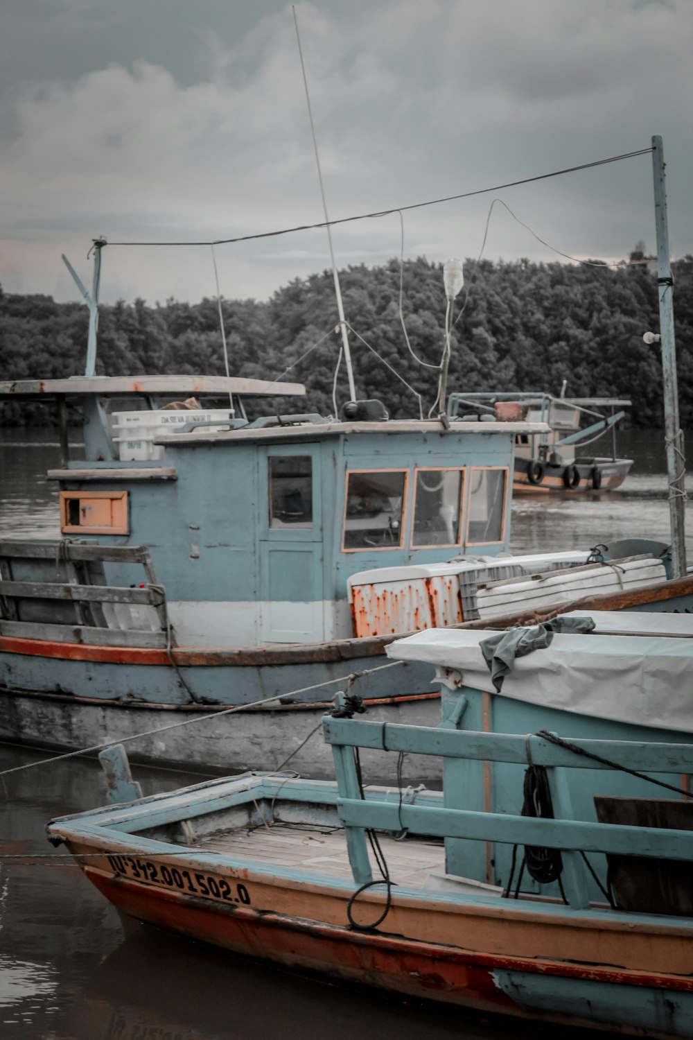 a couple of boats that are sitting in the water