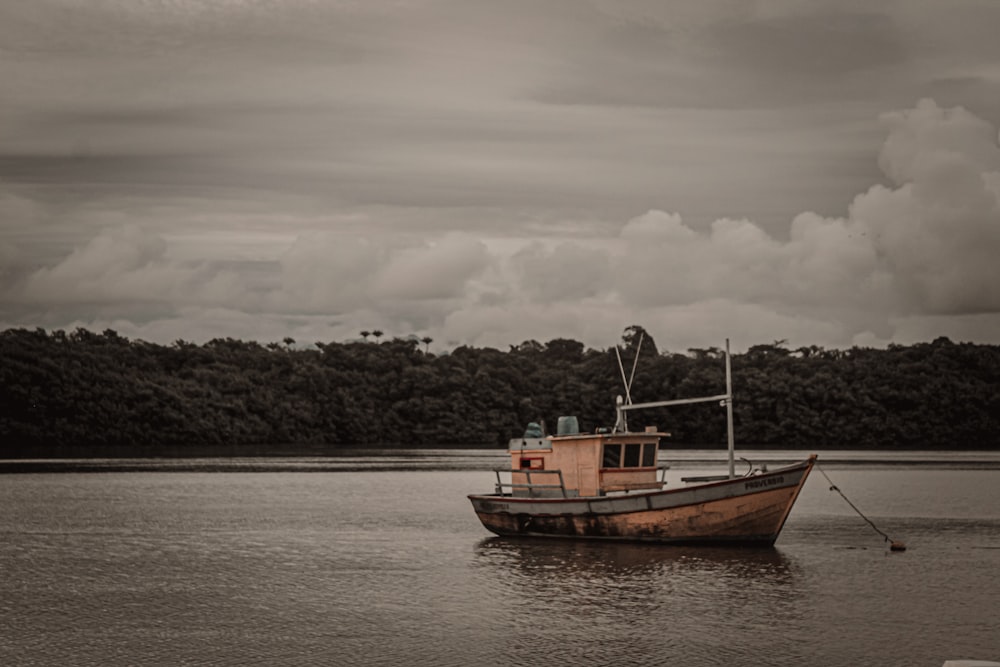 a boat floating on top of a body of water