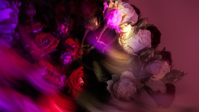 A luxurious crystal bouquet sparkling under soft light with rich red roses.