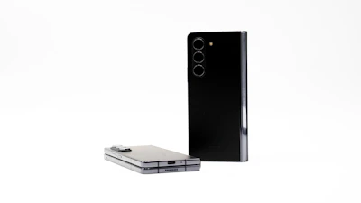 Smartphone view with two product cards per row, maintaining uniform card height and aligned covers.