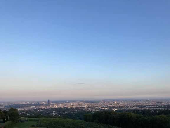 A panoramic view of Khaprail Plus Township under a clear blue sky, showcasing the layout and greenery.