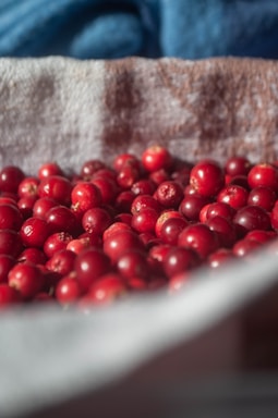 a close up of a bowl of cranberries