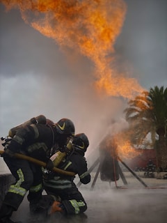 Firefighters in action combating a forest fire in a rural area.