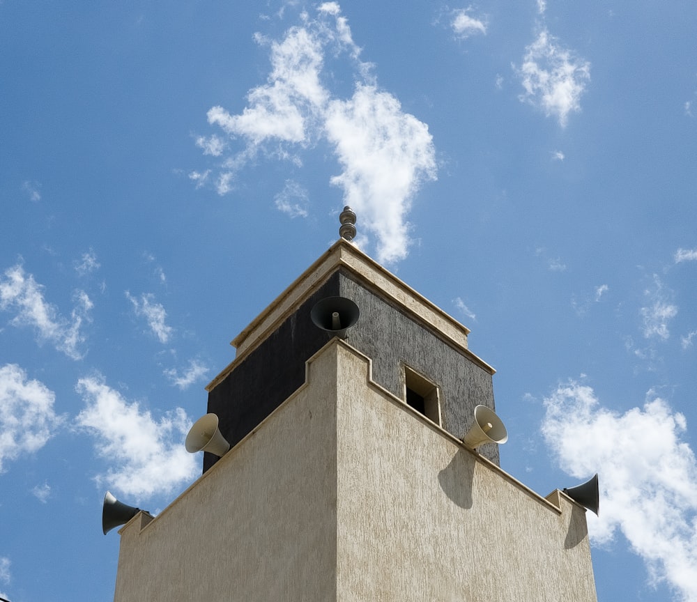 a tall building with a clock on the top of it