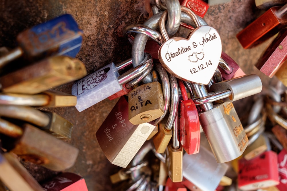 a bunch of padlocks that are attached to a wall