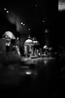 Evening ambiance with dim lights casting gentle shadows over the bar area.