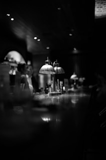 Evening ambiance with dim lights casting gentle shadows over the bar area.