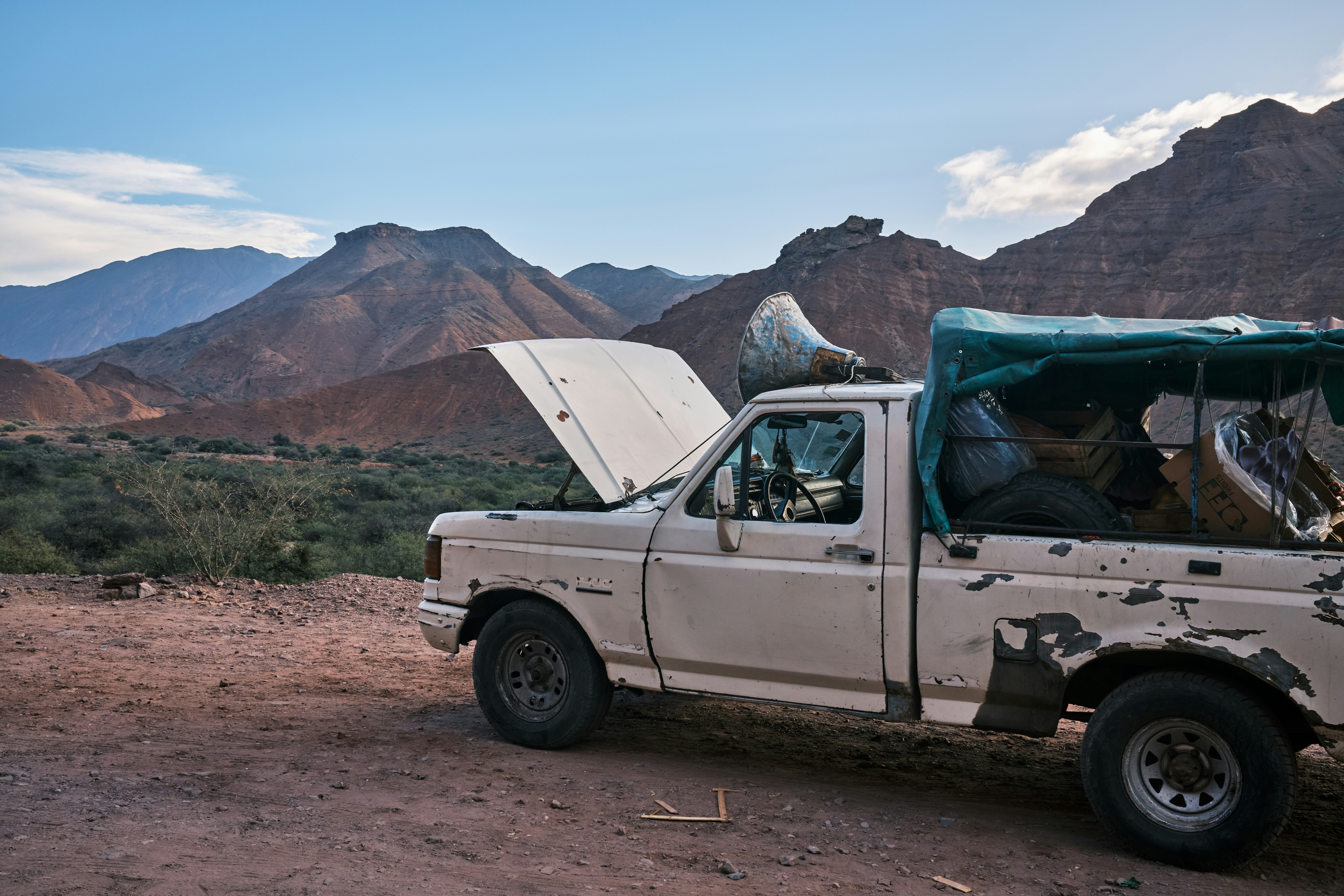 a truck with a tent on the back of it