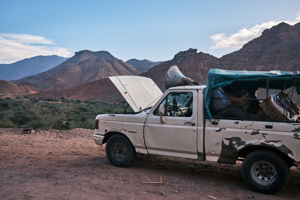 a truck with a tent on the back of it