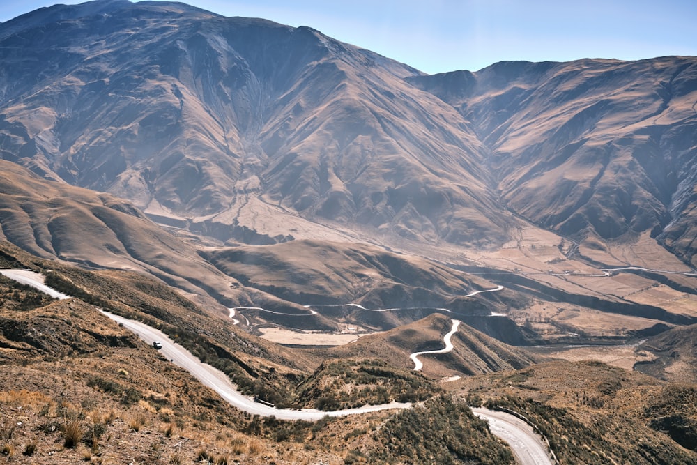 a view of a winding road in the mountains