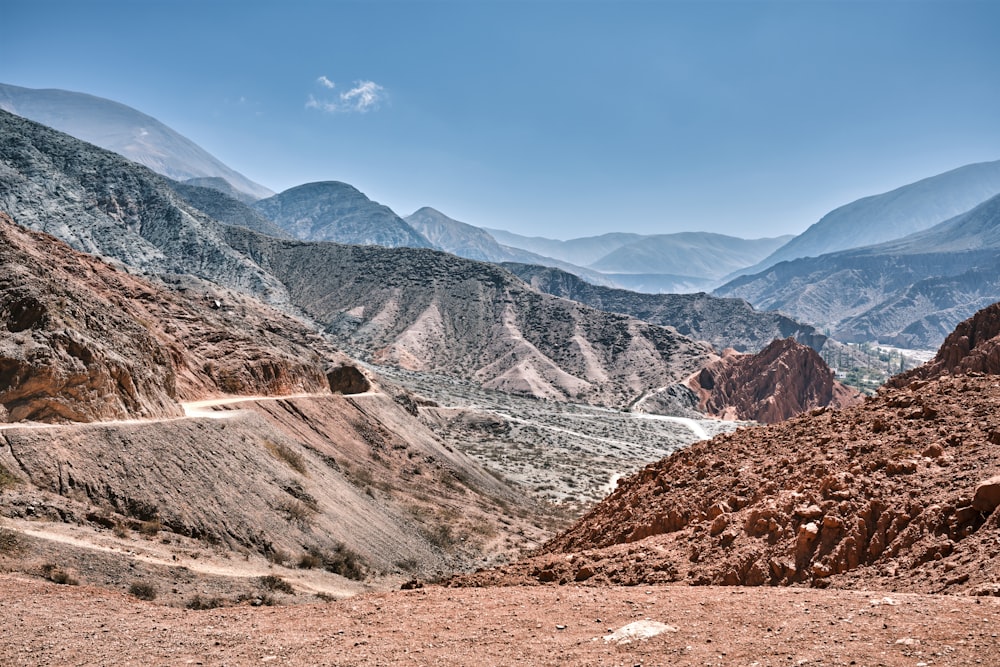 a dirt road in the middle of a mountain range