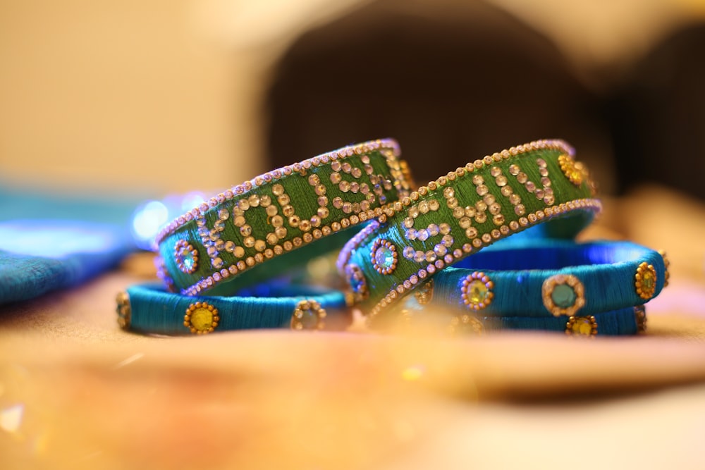 a couple of bracelets sitting on top of a table