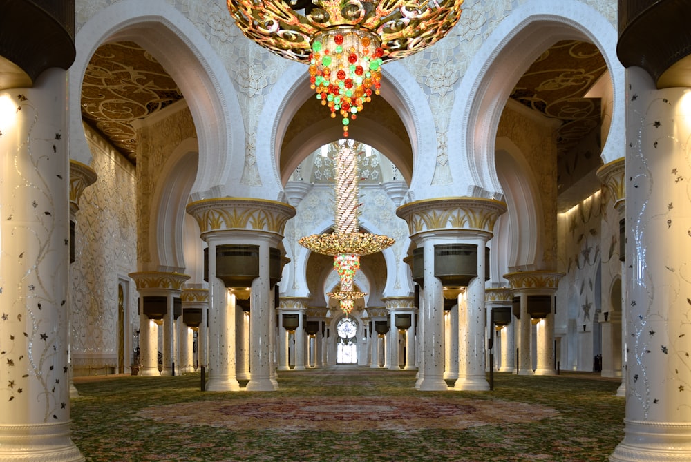 a large room with a chandelier hanging from the ceiling