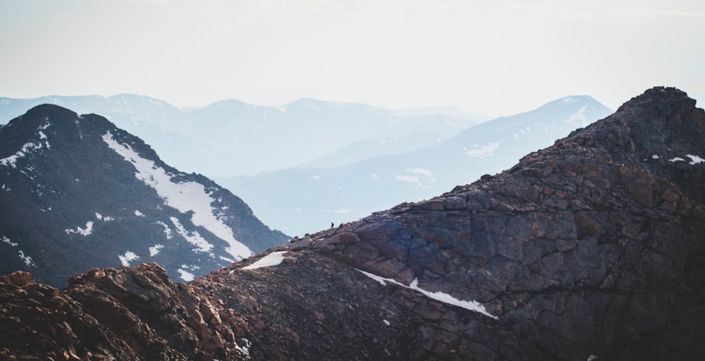 a mountain range with snow covered mountains in the background