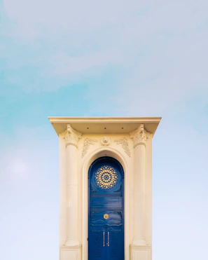 Close-up of a galpon entrance featuring elegant dark blue and gold design details.