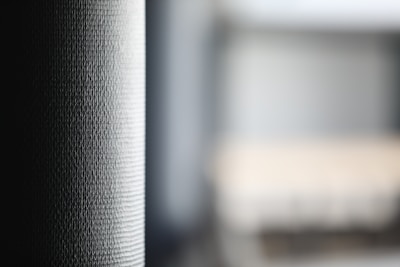 Soft-focus image of a work-in-progress sign on a wooden desk.
