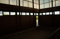 A view of the room showcasing large windows and natural light.