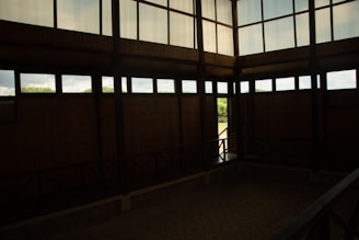 A view of the room showcasing large windows and natural light.