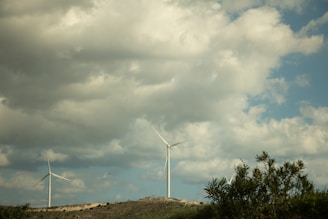 A wind turbine farm on a hillside.