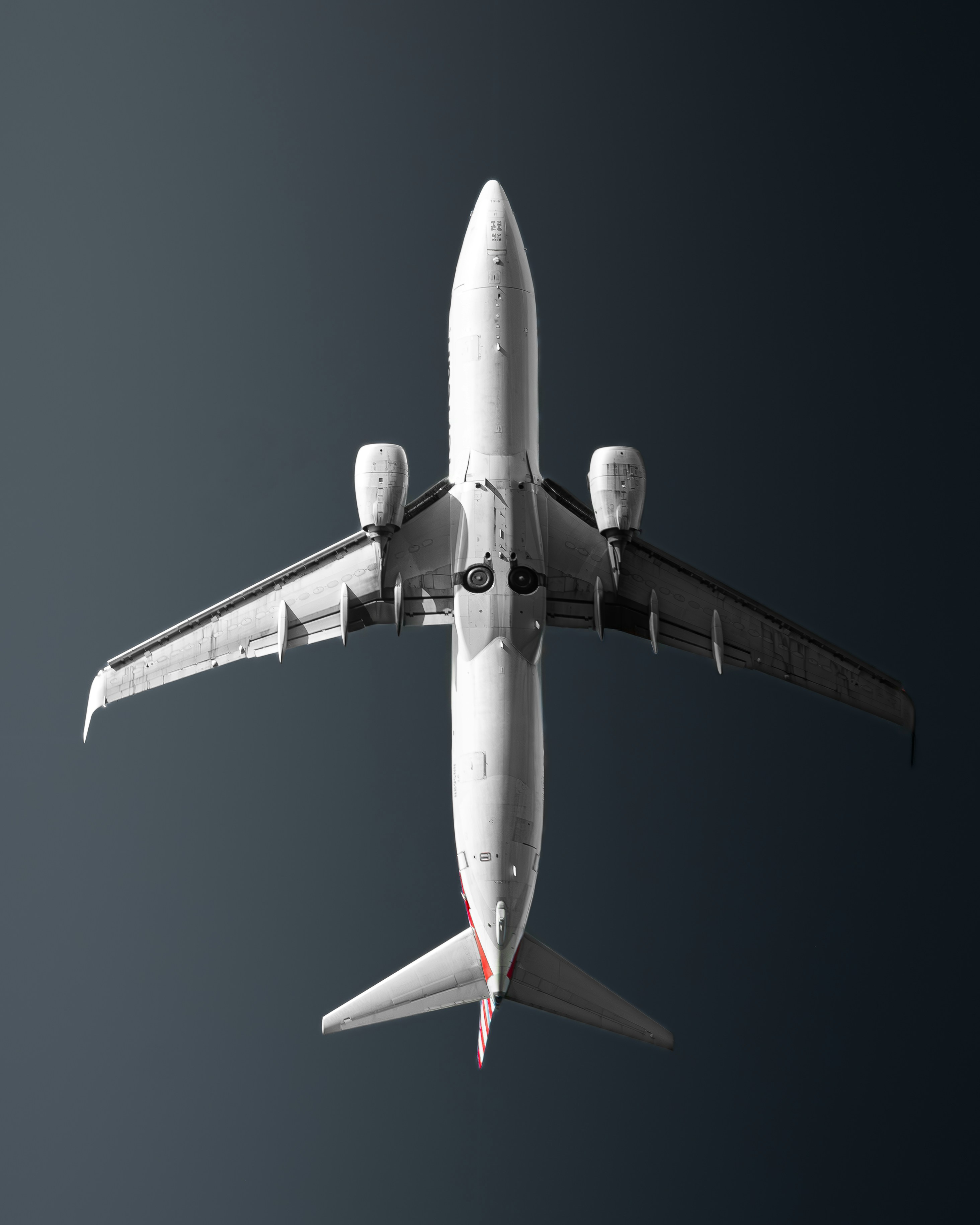 a large jetliner flying through a blue sky