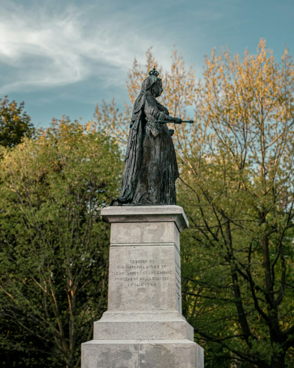 a statue of a woman holding a gun