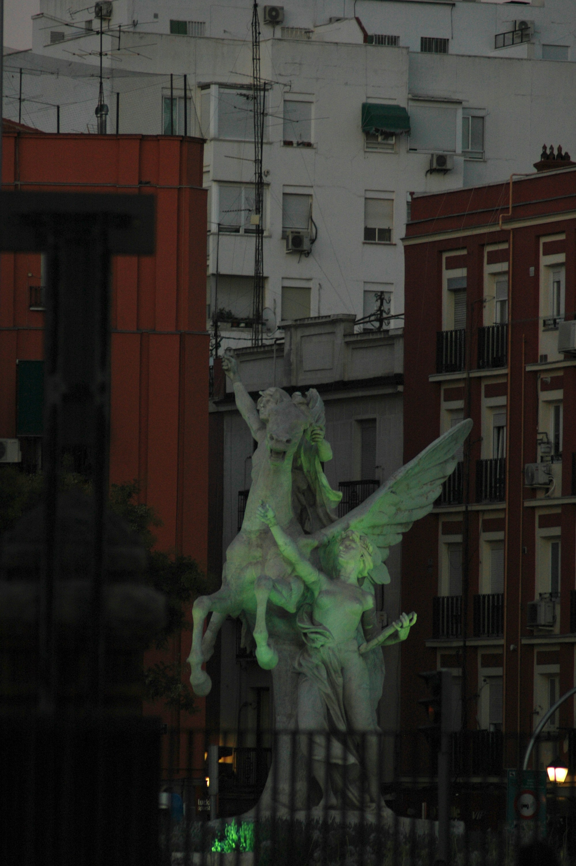 A statue of a woman riding a horse in a city photo – Free Woman Image ...