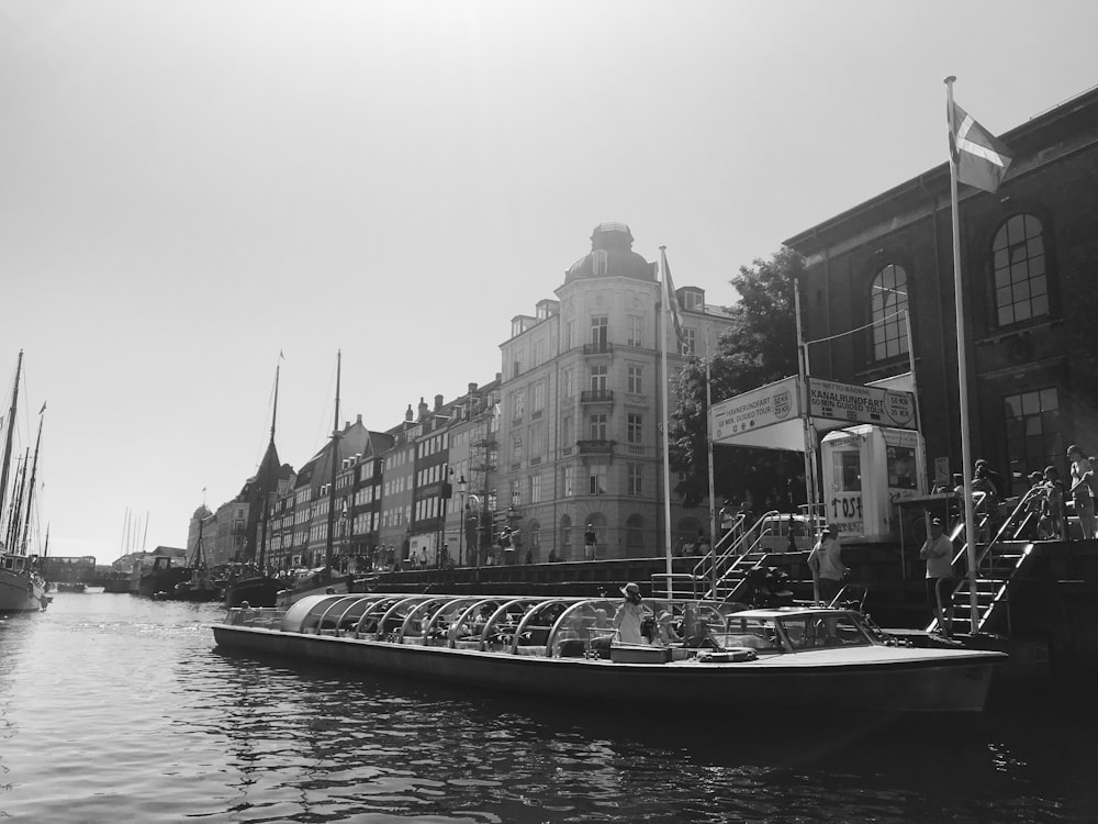 a black and white photo of a boat in the water