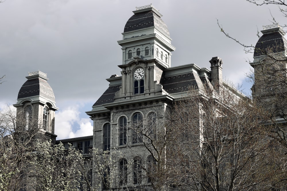 a large building with a clock on the front of it