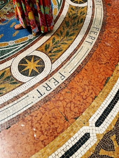 a colorful floor with a clock on the top of it