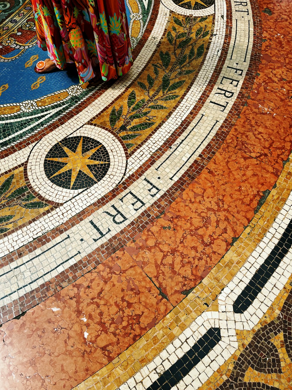 a colorful floor with a clock on the top of it