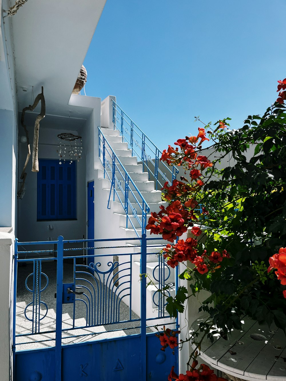 a white and blue building with a blue door