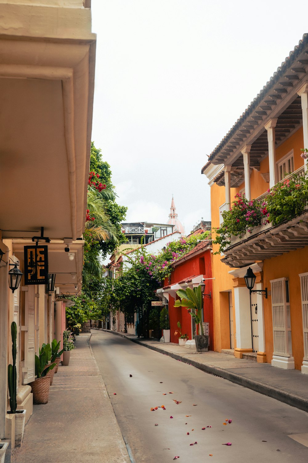 a narrow street lined with colorful buildings