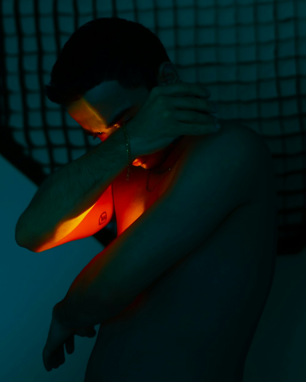 a man holding his arm around a glowing object