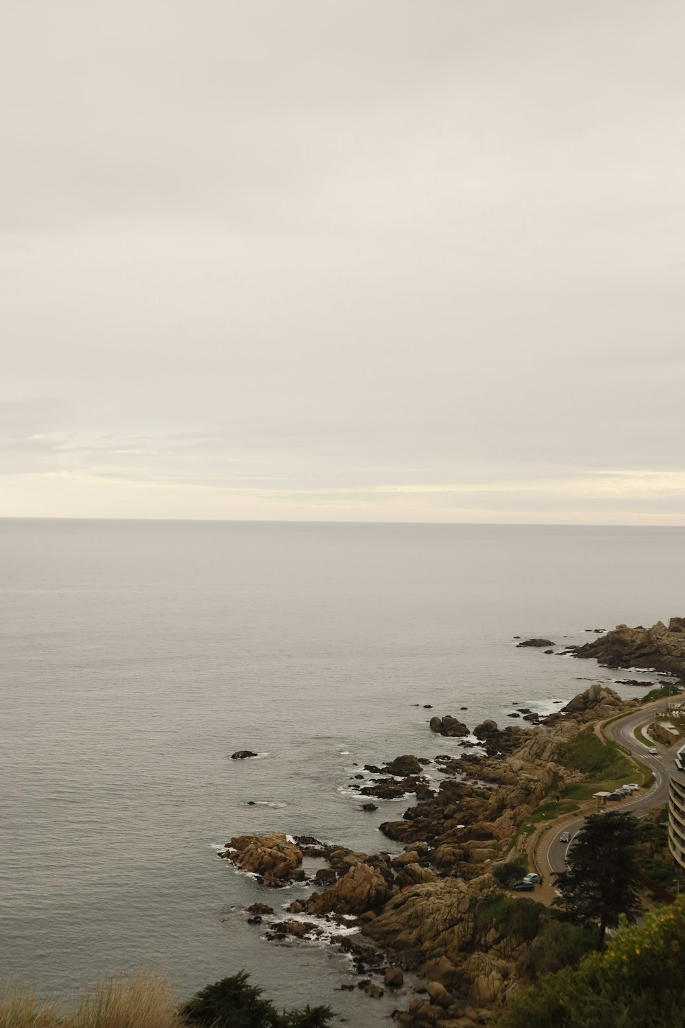 a view of the ocean from a hill top