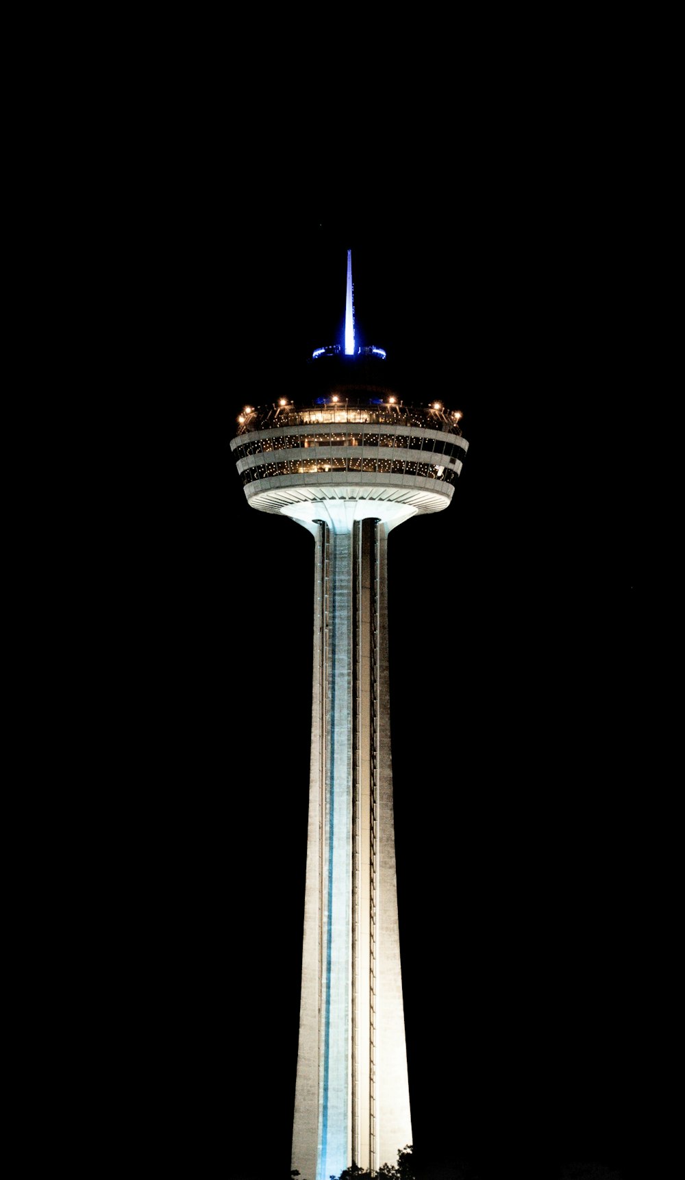 a very tall tower with a sky scraper on top of it