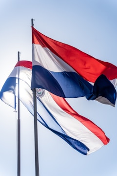 a couple of flags that are flying in the air