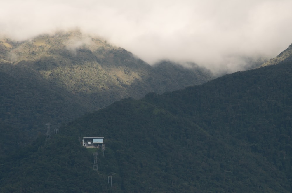 a house in the middle of a mountain range