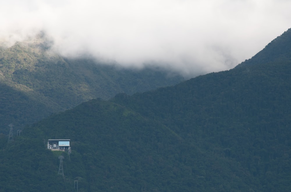 a house in the middle of a mountain range