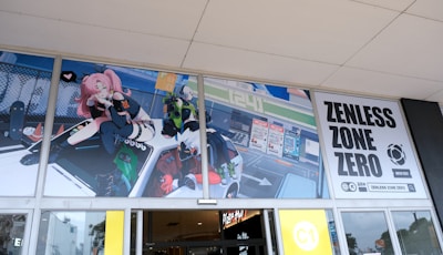 An animated promotional banner for Zenless Zone Zero features colorful characters and dynamic artwork displayed above glass doors. A pink-haired character with futuristic attire sits on a vehicle, while other animated figures appear around it. The banner includes bold text with the game’s title.
