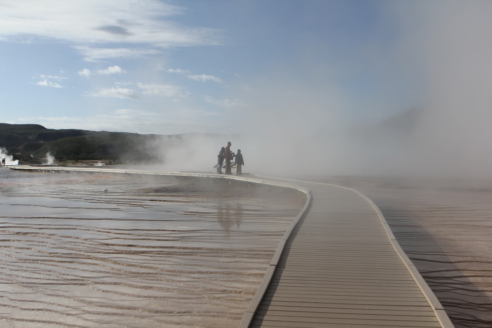 a couple of people riding on the back of a motorcycle