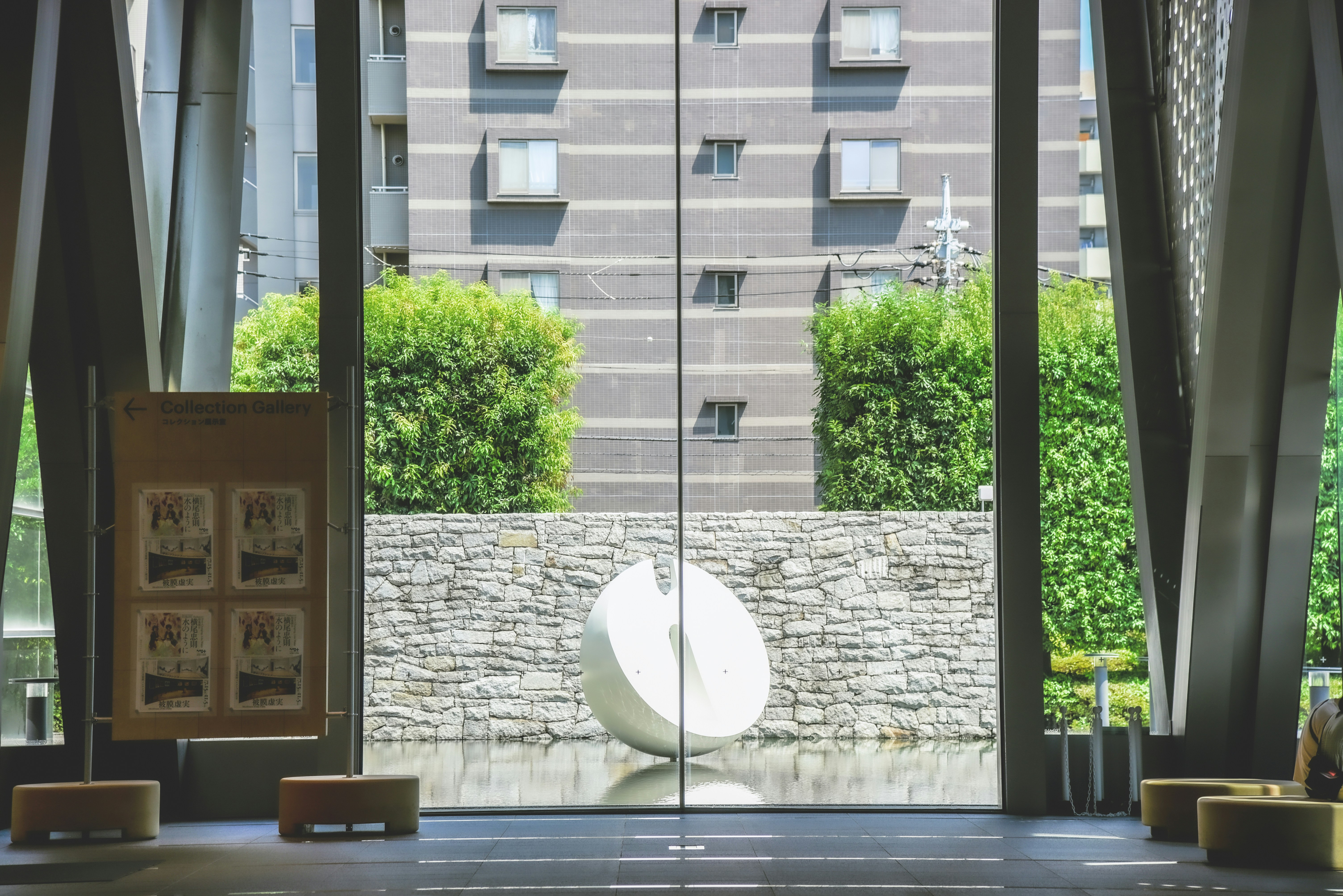 a room with a large glass door that has a large white object in it