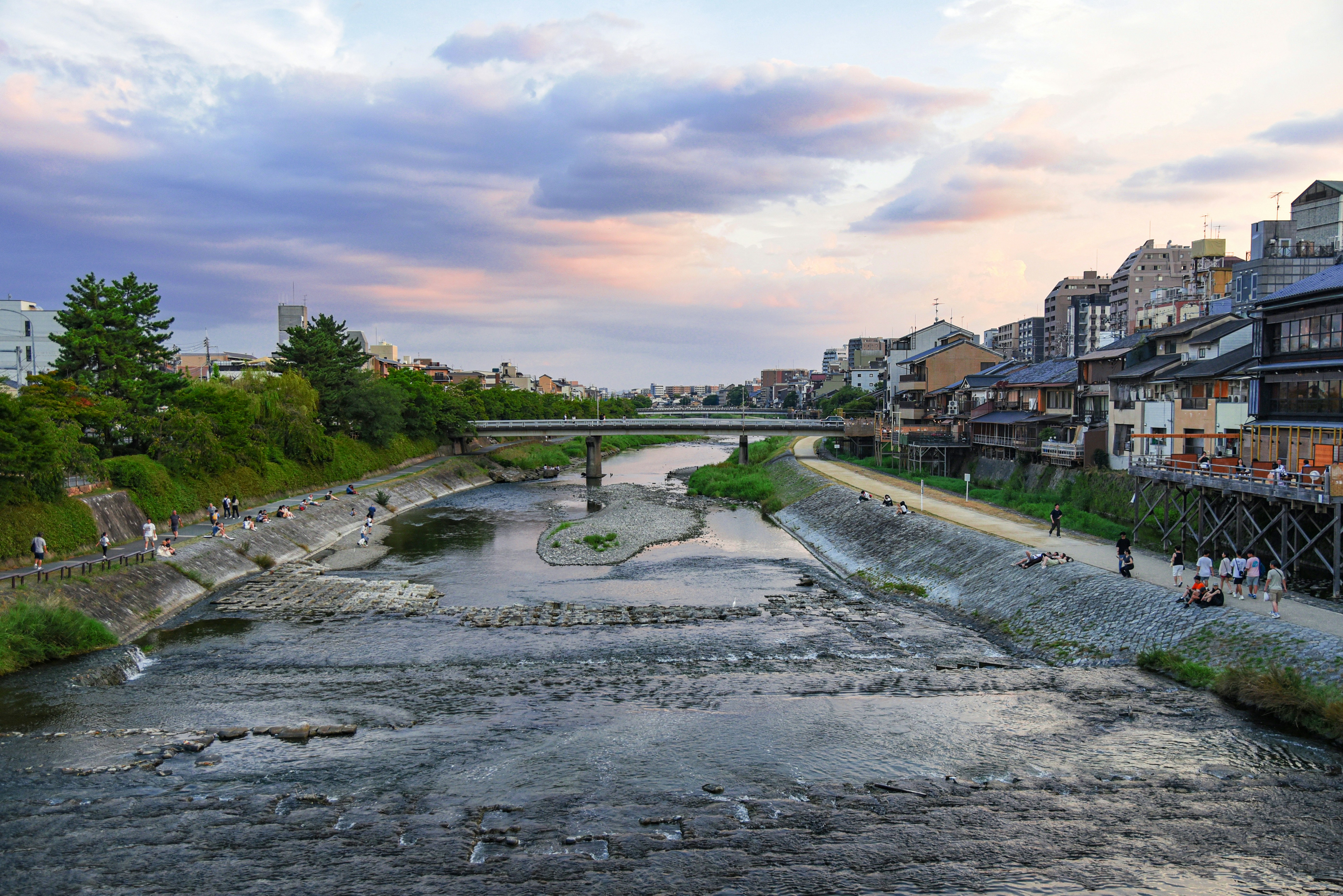 The Kamogawa river running through Kyoto with traditional buildings along the bank